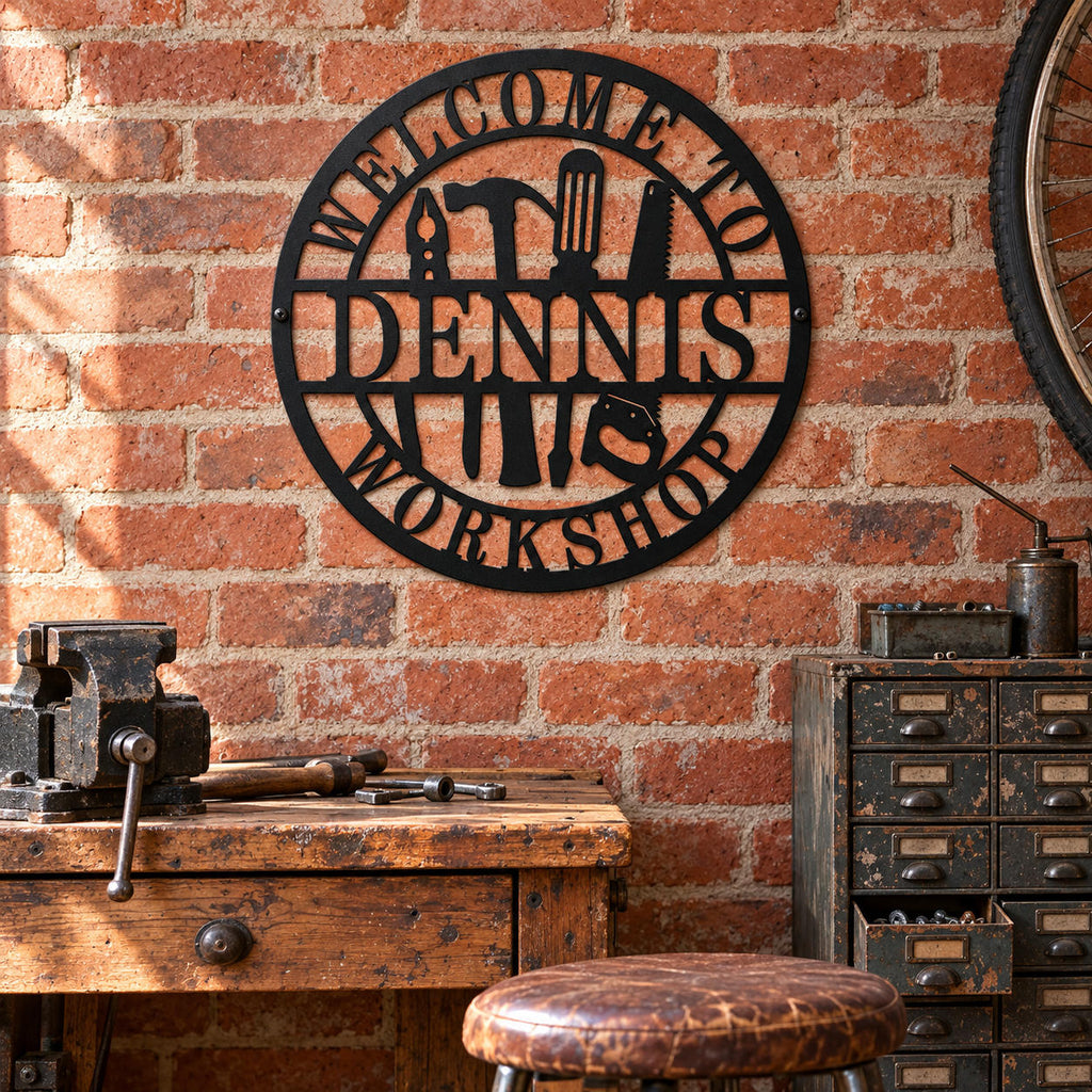 Dennis workshop metal sign on an exposed brick wall above a vintage repair bench with a vise and metal parts drawers.