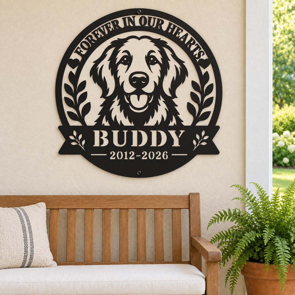 Black metal golden retriever memorial sign for Buddy on a beige covered porch wall above a wooden bench beside a potted fern.