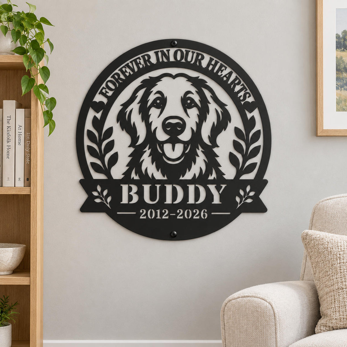 Personalized golden retriever memorial metal sign on a warm gray living room wall beside an oak bookshelf and cream armchair.
