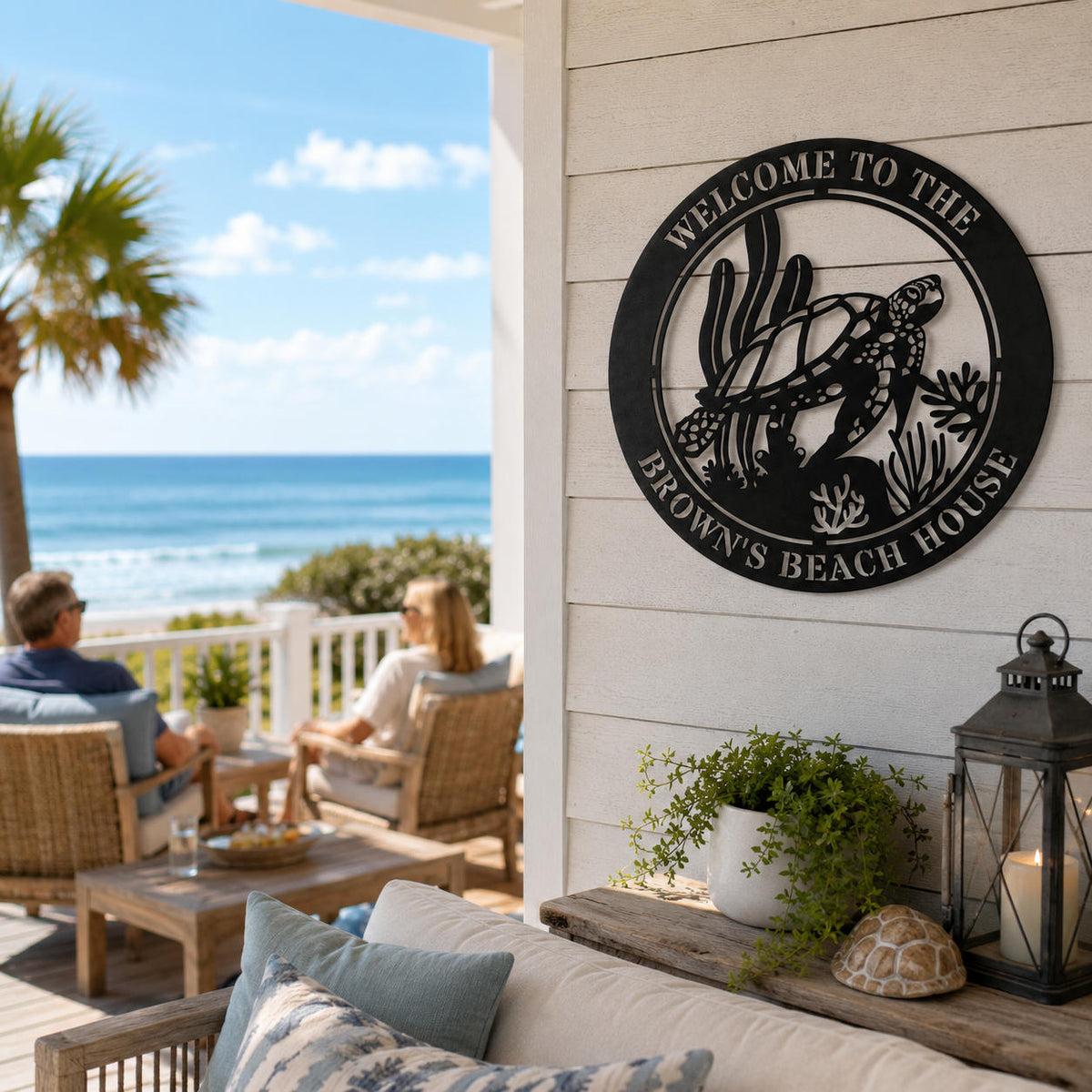Personalized sea turtle metal wall sign displayed on a relaxing oceanfront beach house patio.