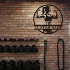 Custom strong woman metal sign with flexing female silhouette and personalized name for gym and fitness wall décor